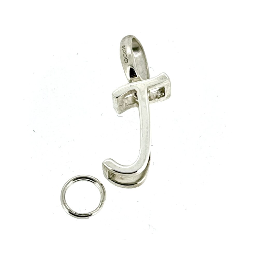 Close-up of the vintage Links of London Sterling Silver 3D Letter J Charm.
