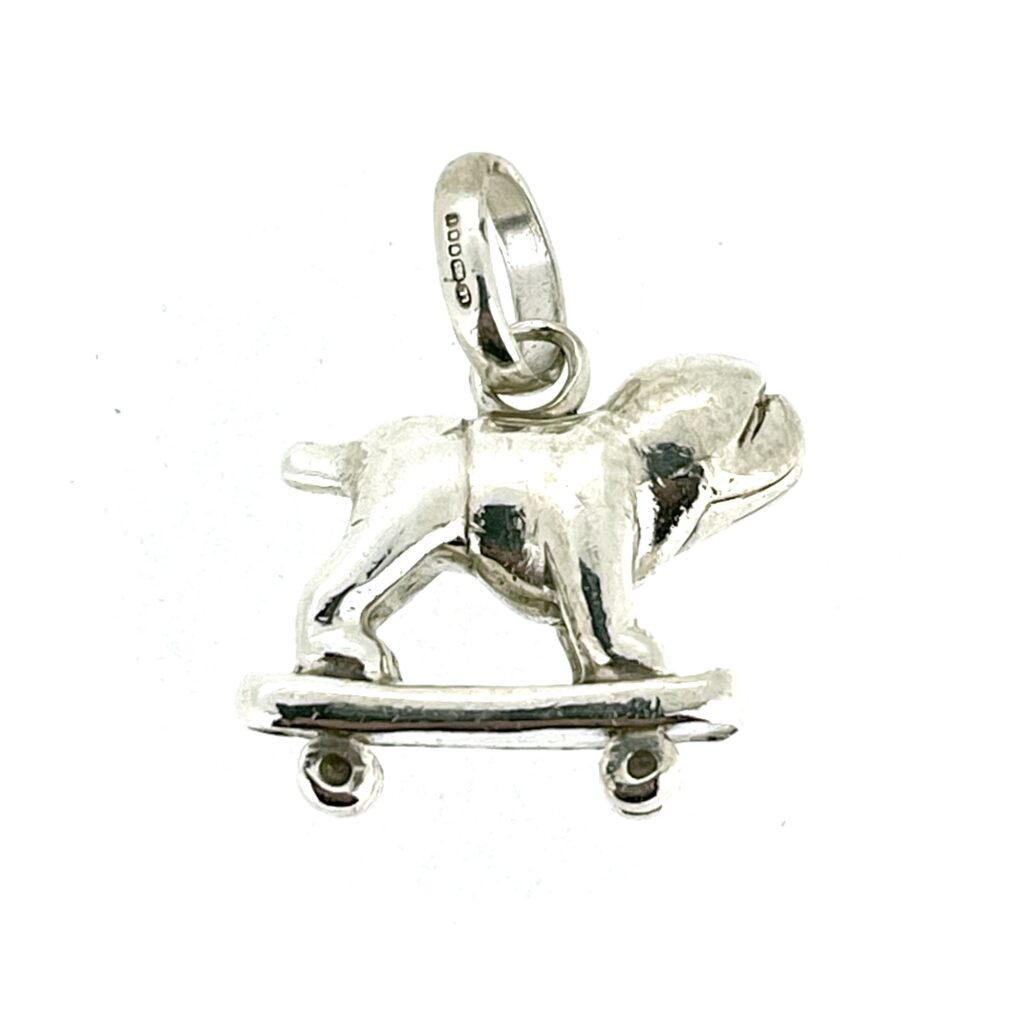 Close-up of the vintage Links of London Sterling Silver Bulldog on a Skateboard Charm.