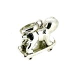 Angled image emphasizing the charm’s unique proportions.