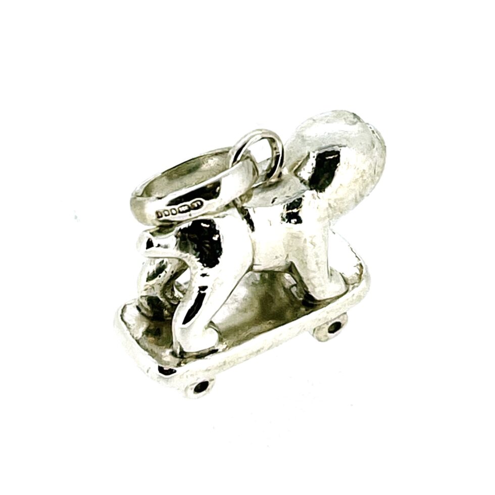 Angled image emphasizing the charm’s unique proportions.