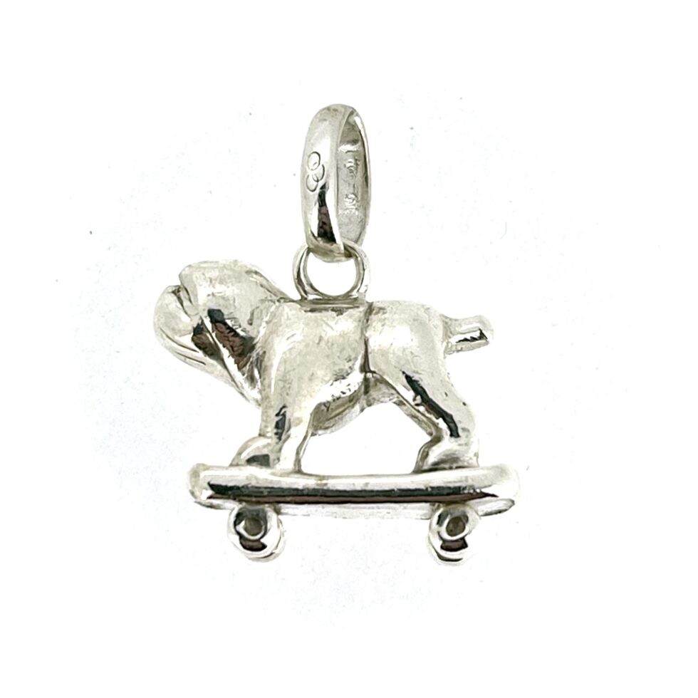 Side view of the Bulldog on a Skateboard Charm, showcasing its polished silver finish.