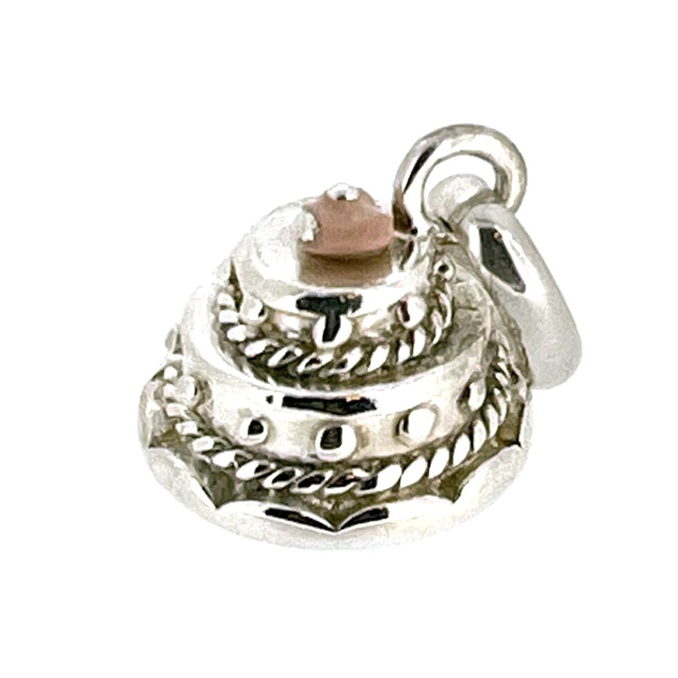Close-up of the Vintage Links of London Wedding Cake Charm highlighting its polished finish.