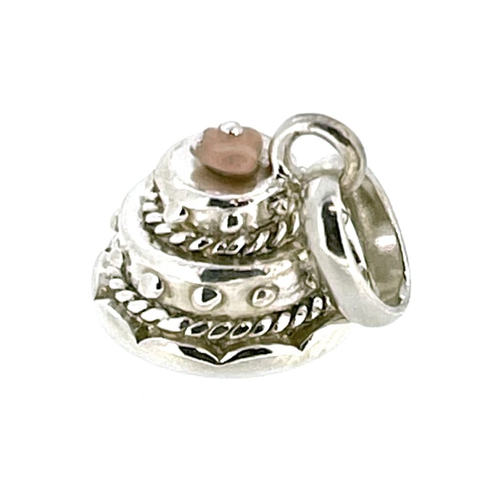 Close-up of the Vintage Links of London Wedding Cake Charm highlighting its polished silver finish.