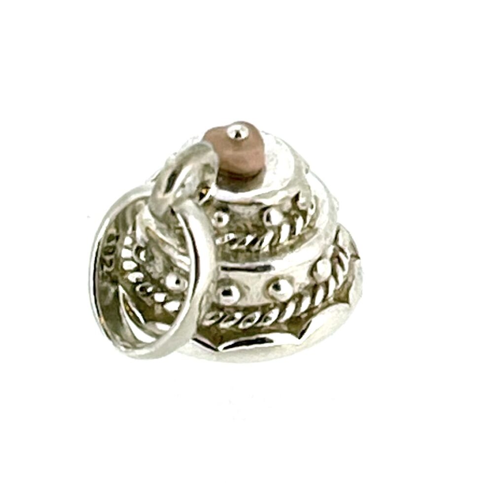 Side profile showcasing the three-tiered design and pink enamel bead.