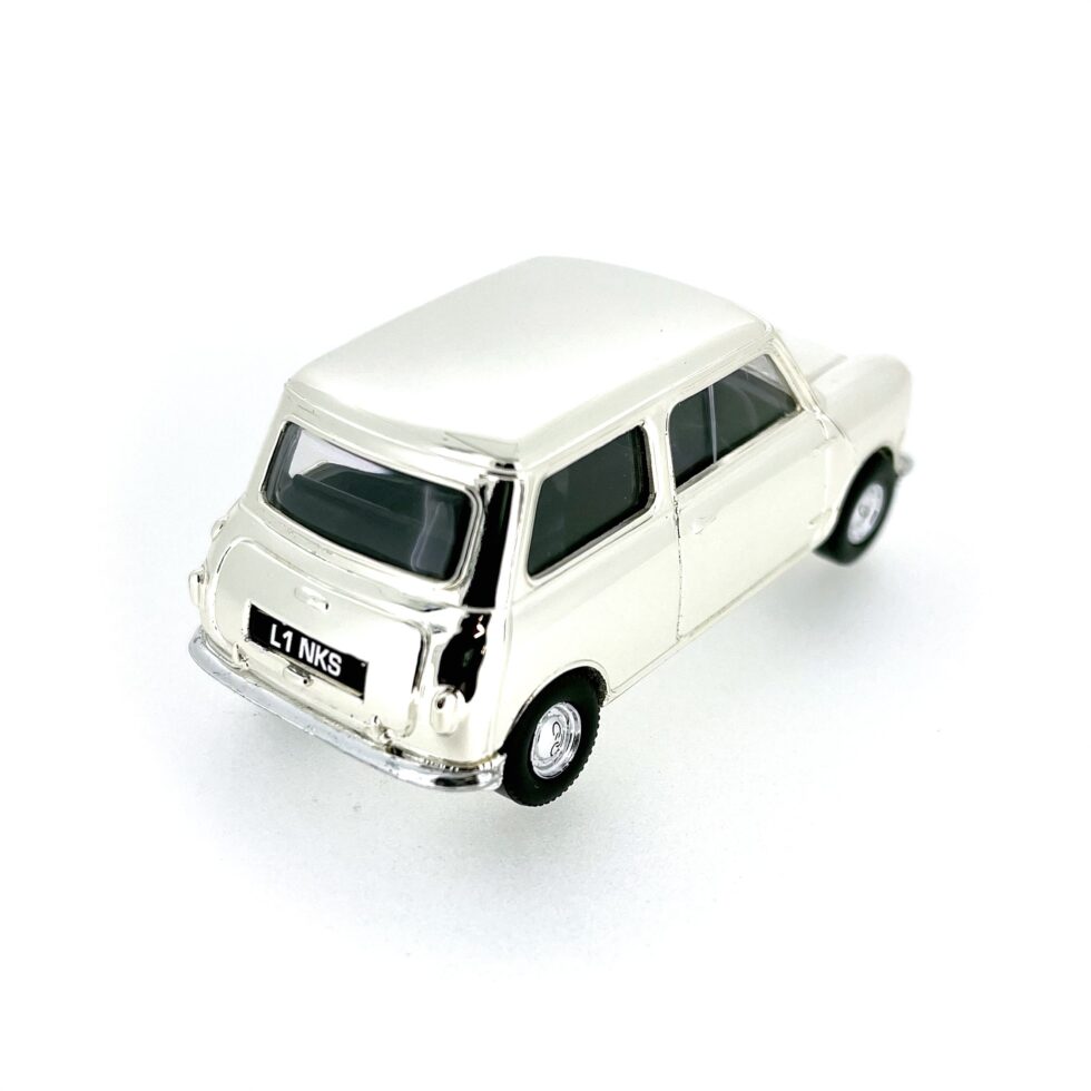 Side view of the Mini Model, highlighting the smooth finish and compact design.