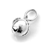 Globe charm photographed in natural light to highlight its polished finish.