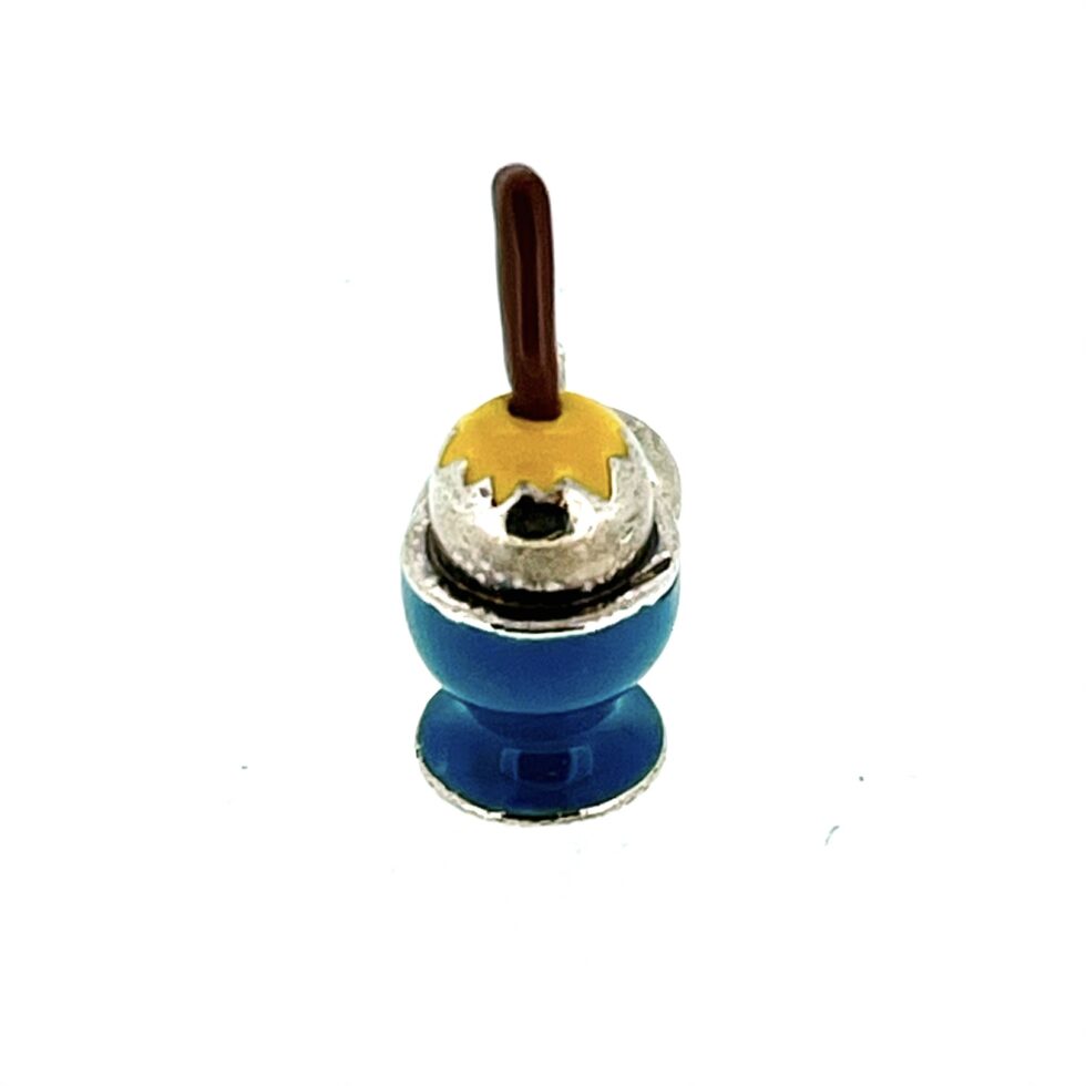 Close-up of the vintage Links of London Eggcup Charm in sterling silver with enamel detailing.