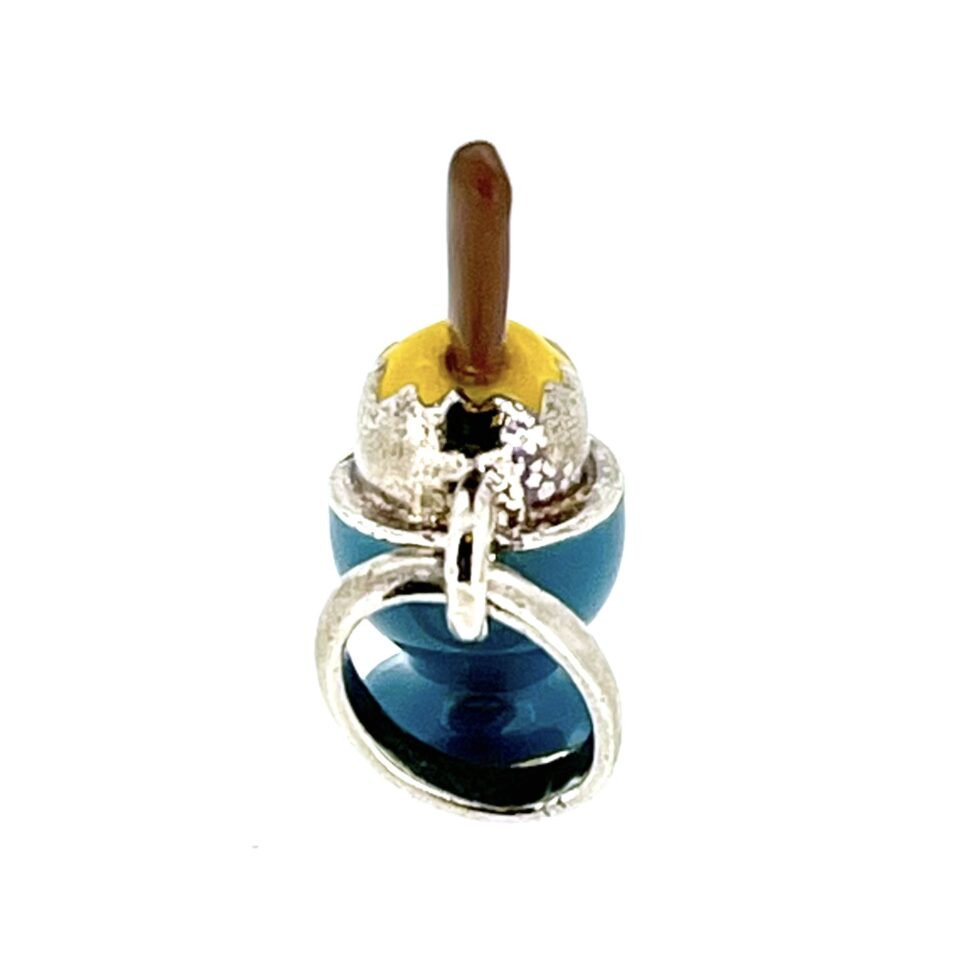Close-up of the charm’s loop and split ring attachment.