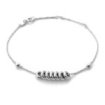 Bracelet photographed in natural light, highlighting its polished sterling silver finish.