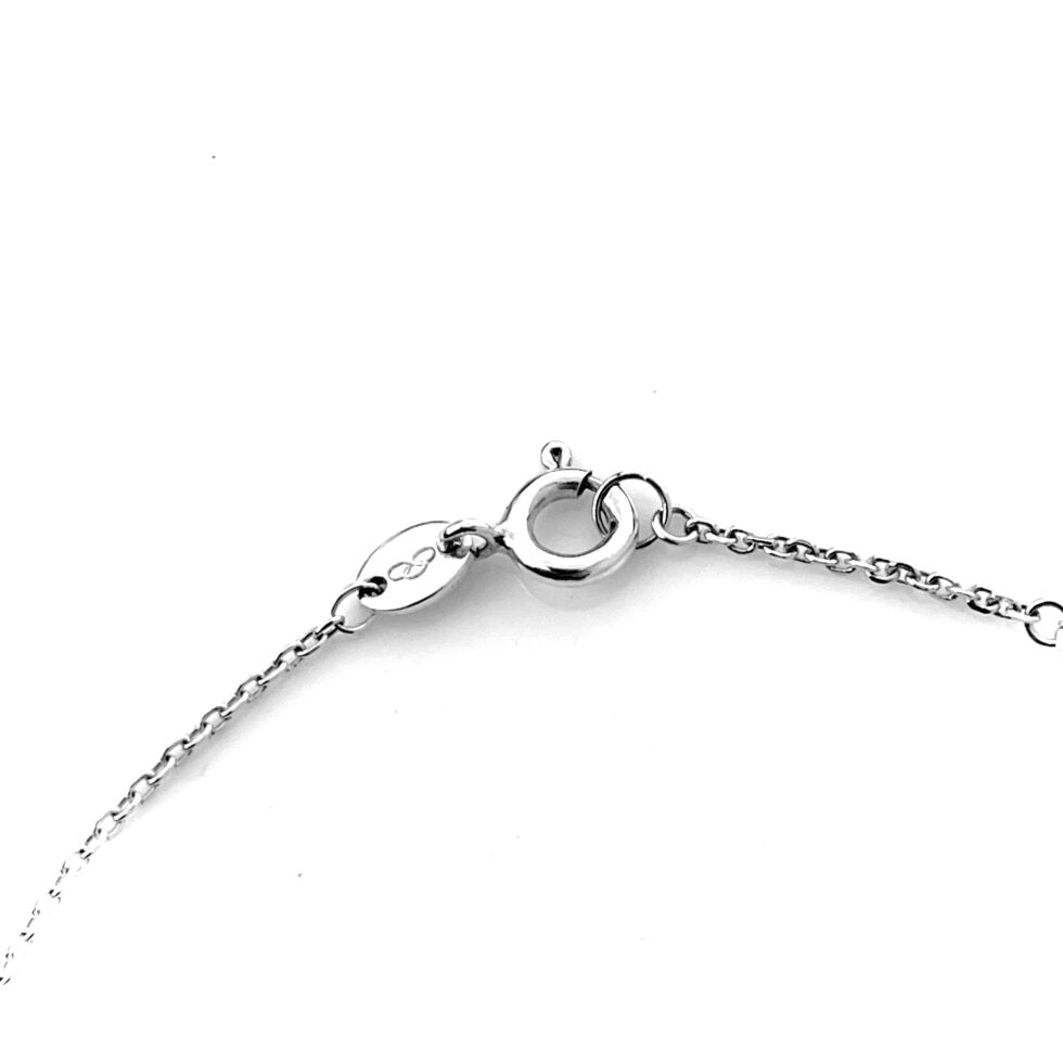 Close-up of the oval Links logo tag and 925 hallmark.