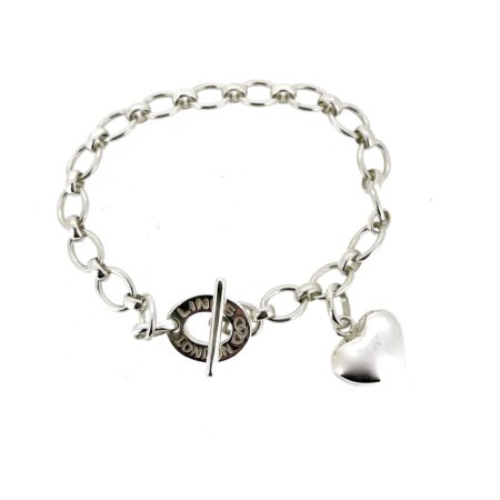 Side view showing the polished heart charm and delicate oval links.