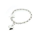 A soft-focus image capturing the romantic aesthetic of the heart charm.