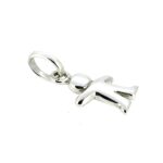 The restored charm reflecting soft light, showcasing its bright finish.