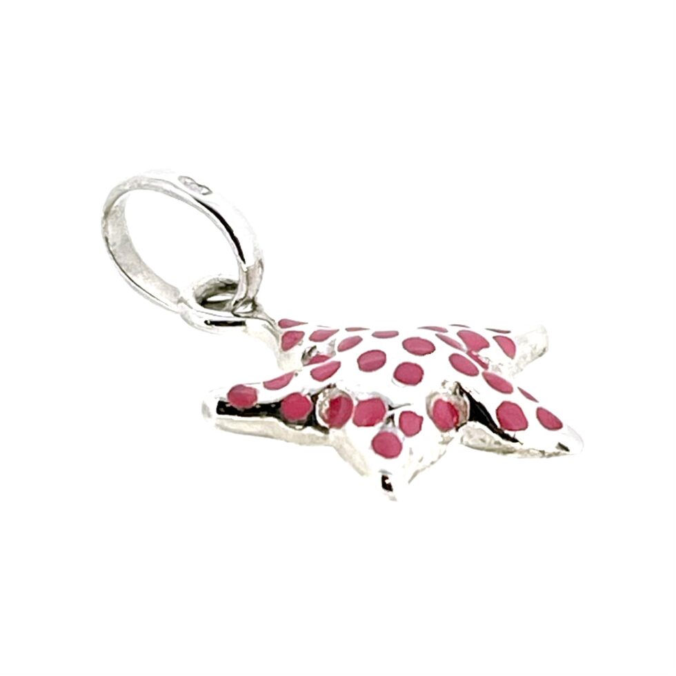 Side view showcasing the pink enamel details on the charm’s curved top.