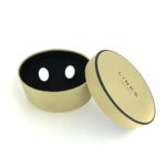 Links of London cufflinks photographed alongside their vintage storage box.