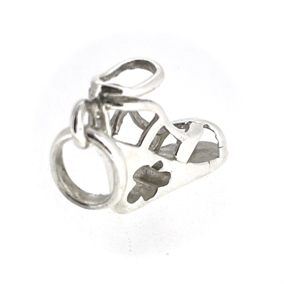 Angled shot capturing the strappy sandal design and ankle strap detail.