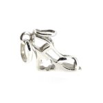 Side view showcasing the floral cutout detail in the wedge heel.