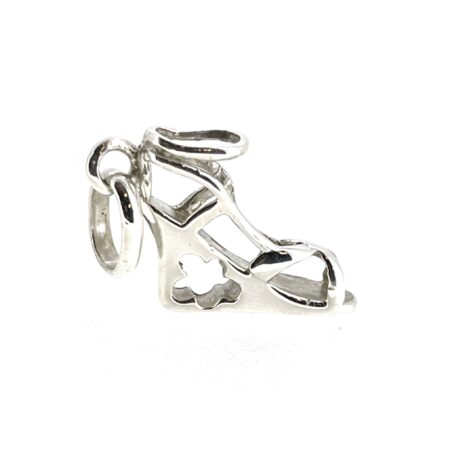 Side view showcasing the floral cutout detail in the wedge heel.