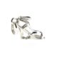 Side view showcasing the floral cutout detail in the wedge heel.