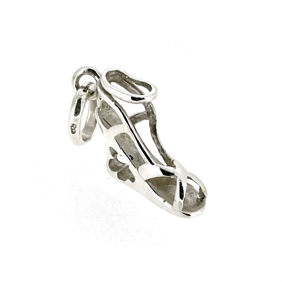 The charm displayed on a white background, highlighting its polished sterling silver finish.