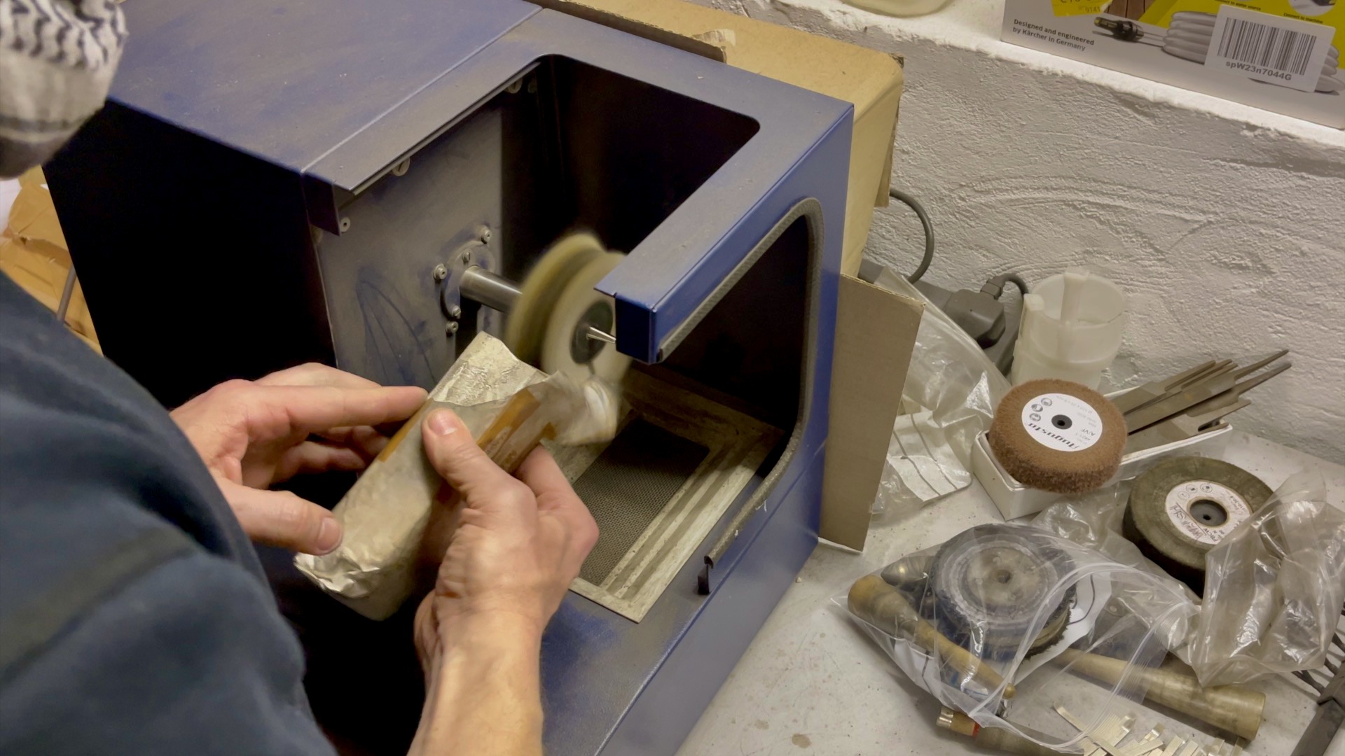 using Hyfin polish on a jewellers polishing motor