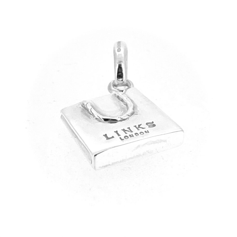 Close-up of the vintage 2010 Links of London Bag Charm in polished sterling silver.