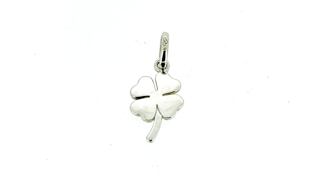 Close-up of scratches and wear on the silver four leaf clover charm.
