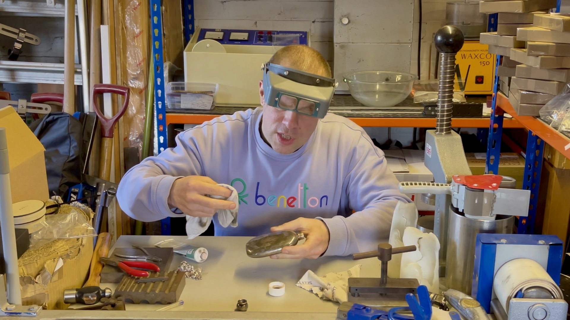 Manual polishing of flask using polishing cream