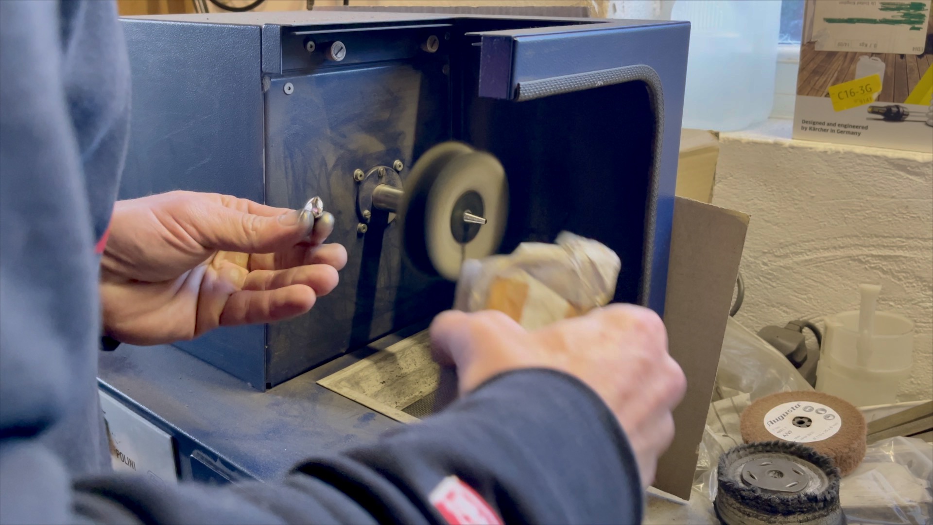 The Links of London heart charm on a jeweler’s polishing motor for a final hand polish.