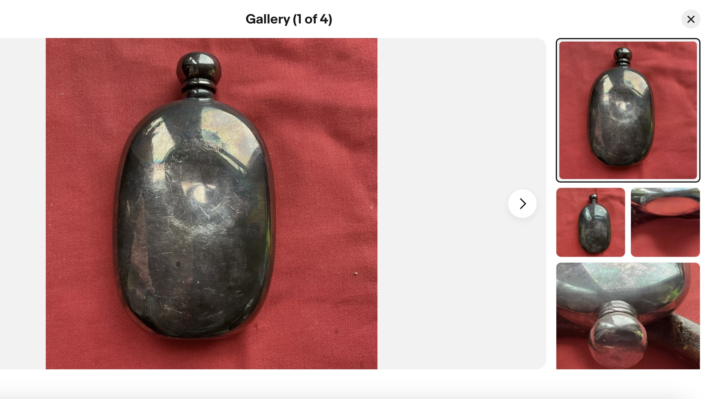 Vintage silver Links of London hip flask before restoration, showing deep dent