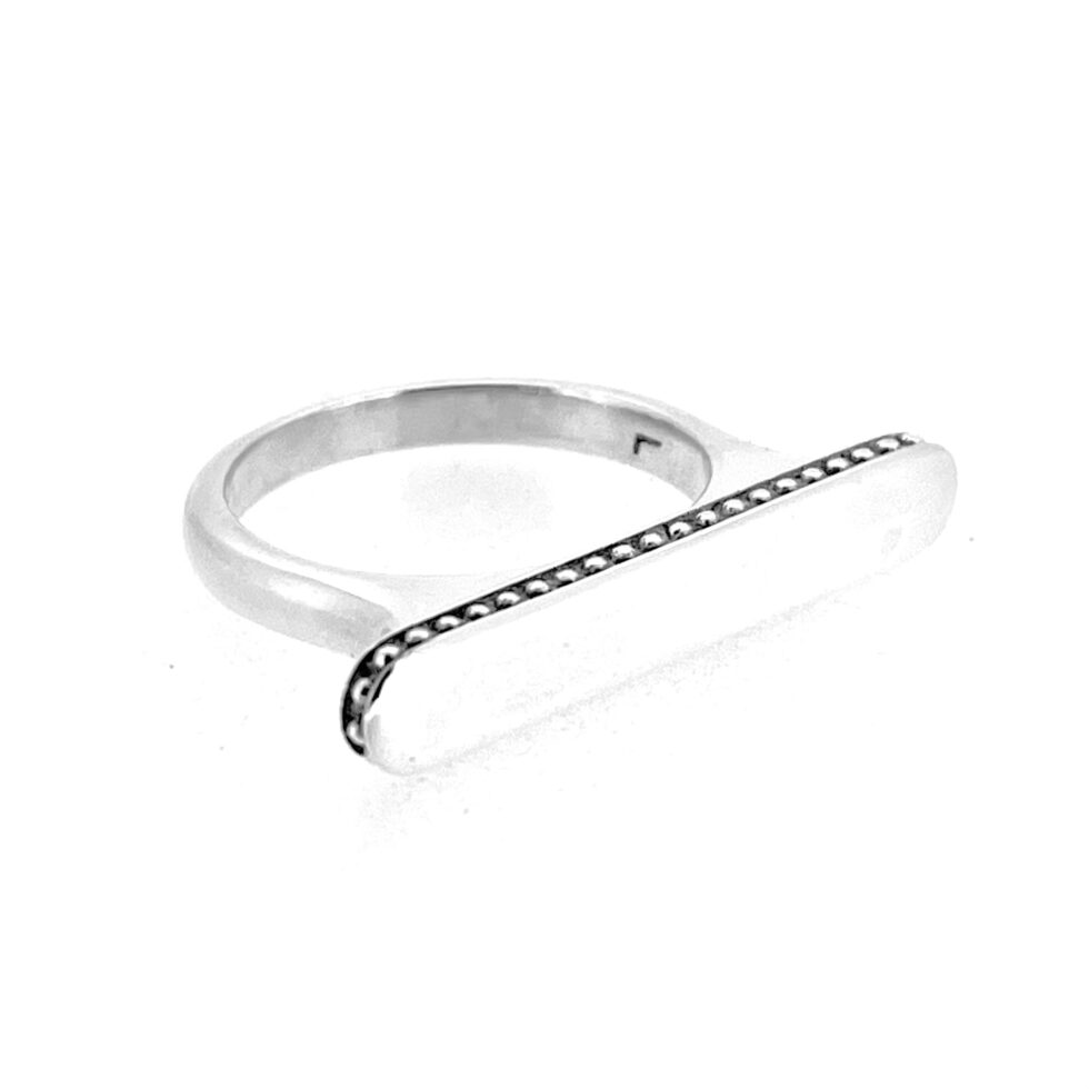 Ring photographed on white silk for The Vault product gallery