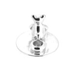 Teddy bear and candle cup on round silver base