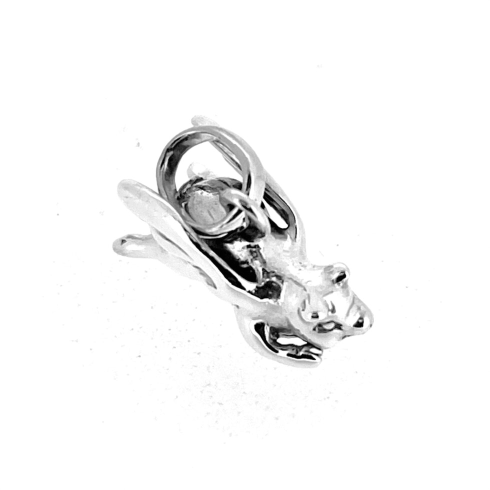 Sterling silver charm shaped like a pig with wings