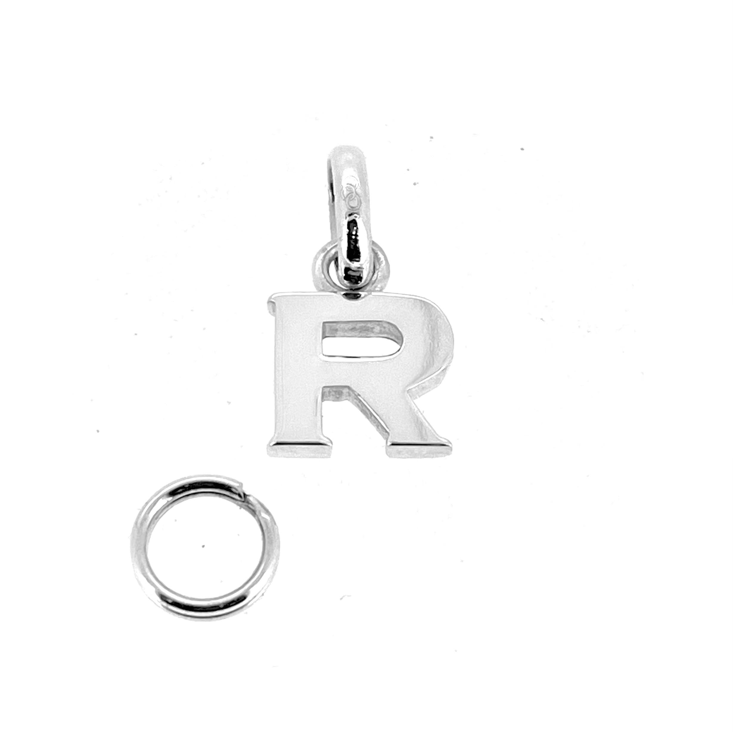 Sterling silver R charm showing jump ring and split ring