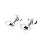Close-up of engraved silver cufflink ovals