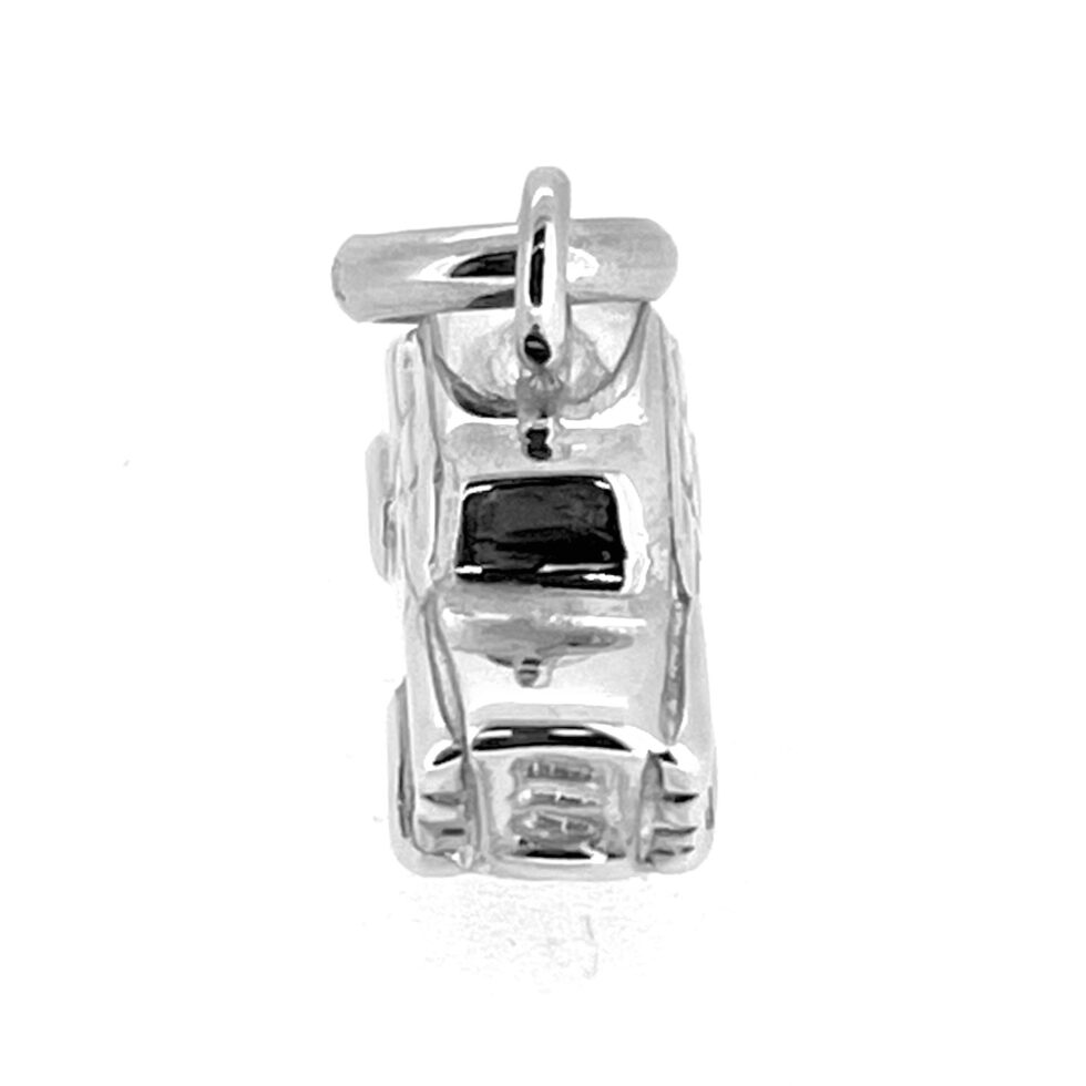 Silver charm shaped like a London taxi