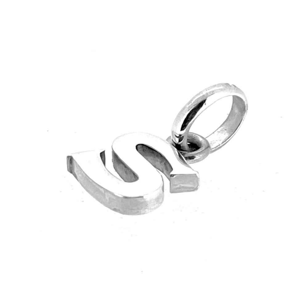 Letter S charm photographed on white background