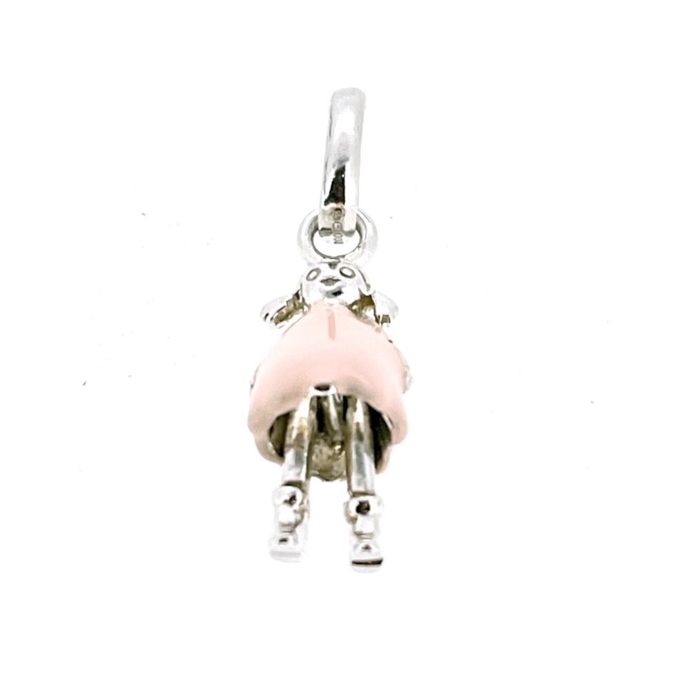 Close-up of movable legs on vintage Links charm