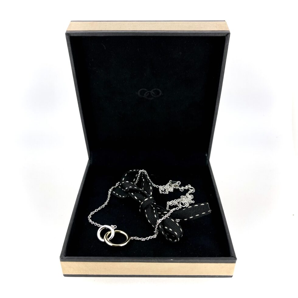 Yellow gold and silver rings interlocked