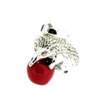 Vintage sterling silver apple hedgehog charm on white background