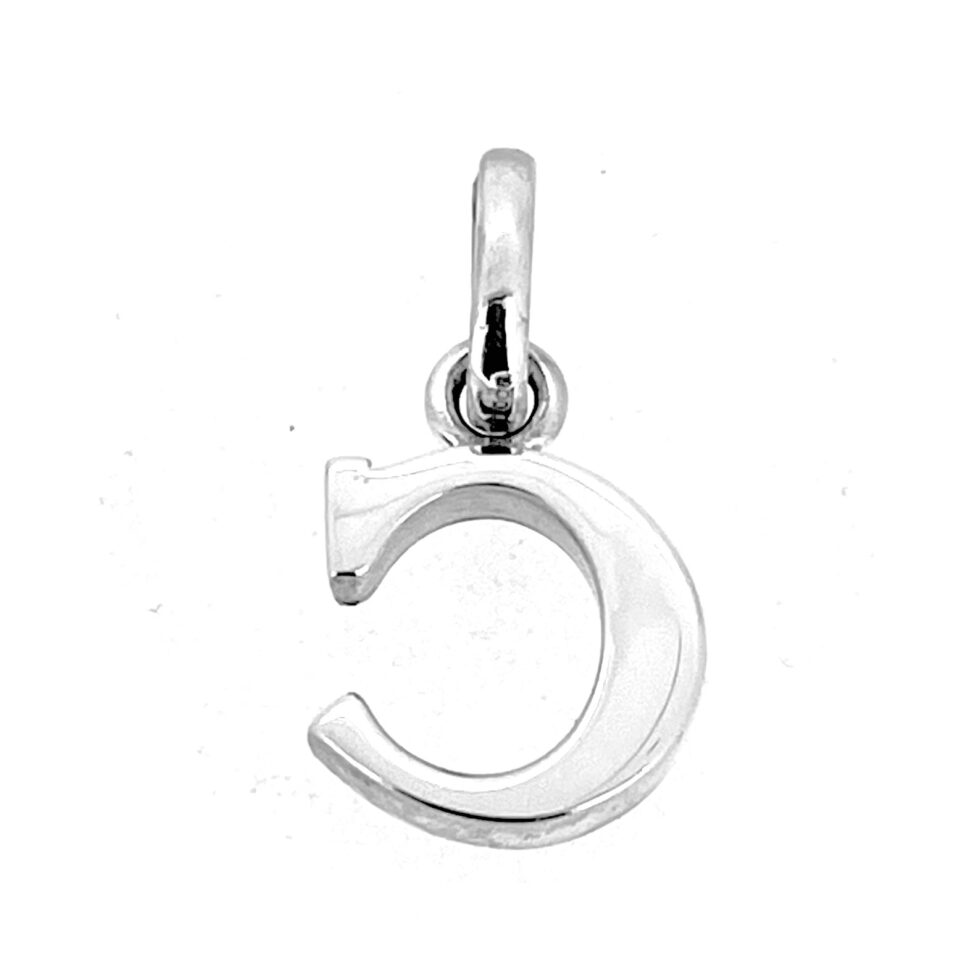 “C” initial charm laid flat on white background