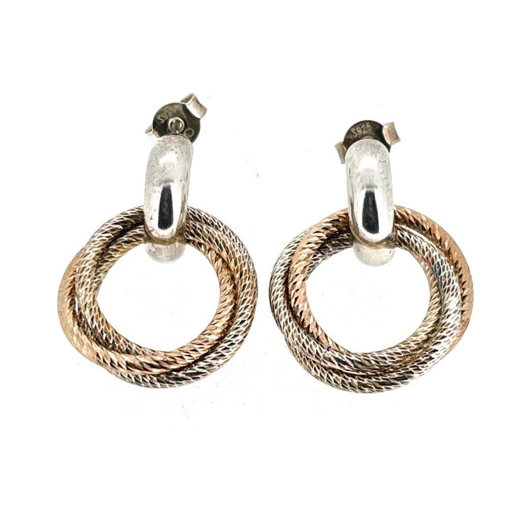 Detail of rose gold vermeil ring among interlocking trio