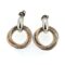 Close-up of two-tone interlocking rings on earrings