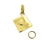 Detail of 18ct gold plating on shopping bag charm.