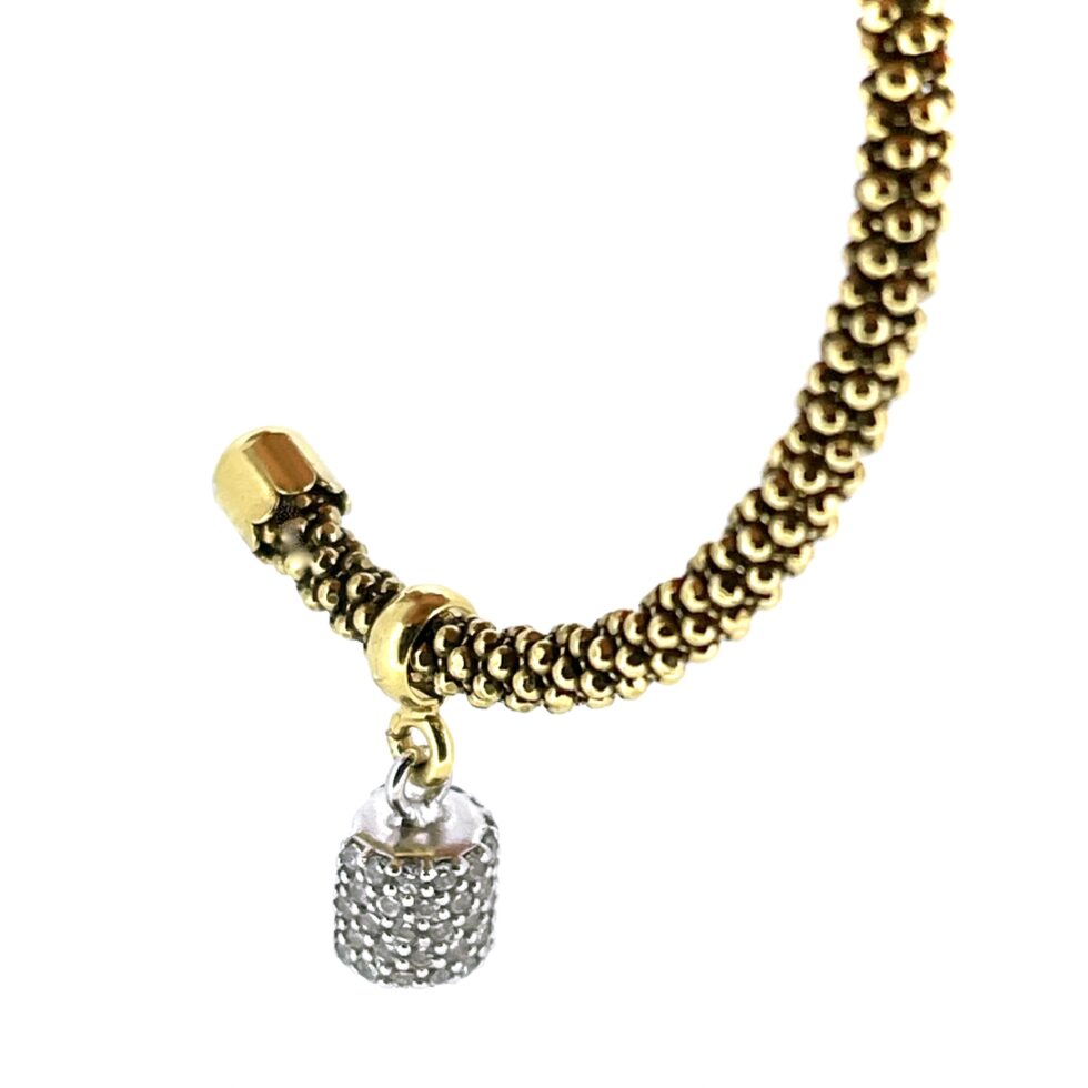 Close-up of bubble texture hoops and pavé drop charms