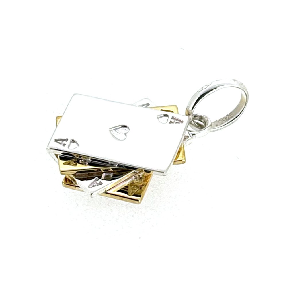 Side view of four stacked cards charm