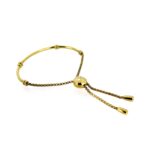 Close-up of gold vermeil half bangle with double bead accents