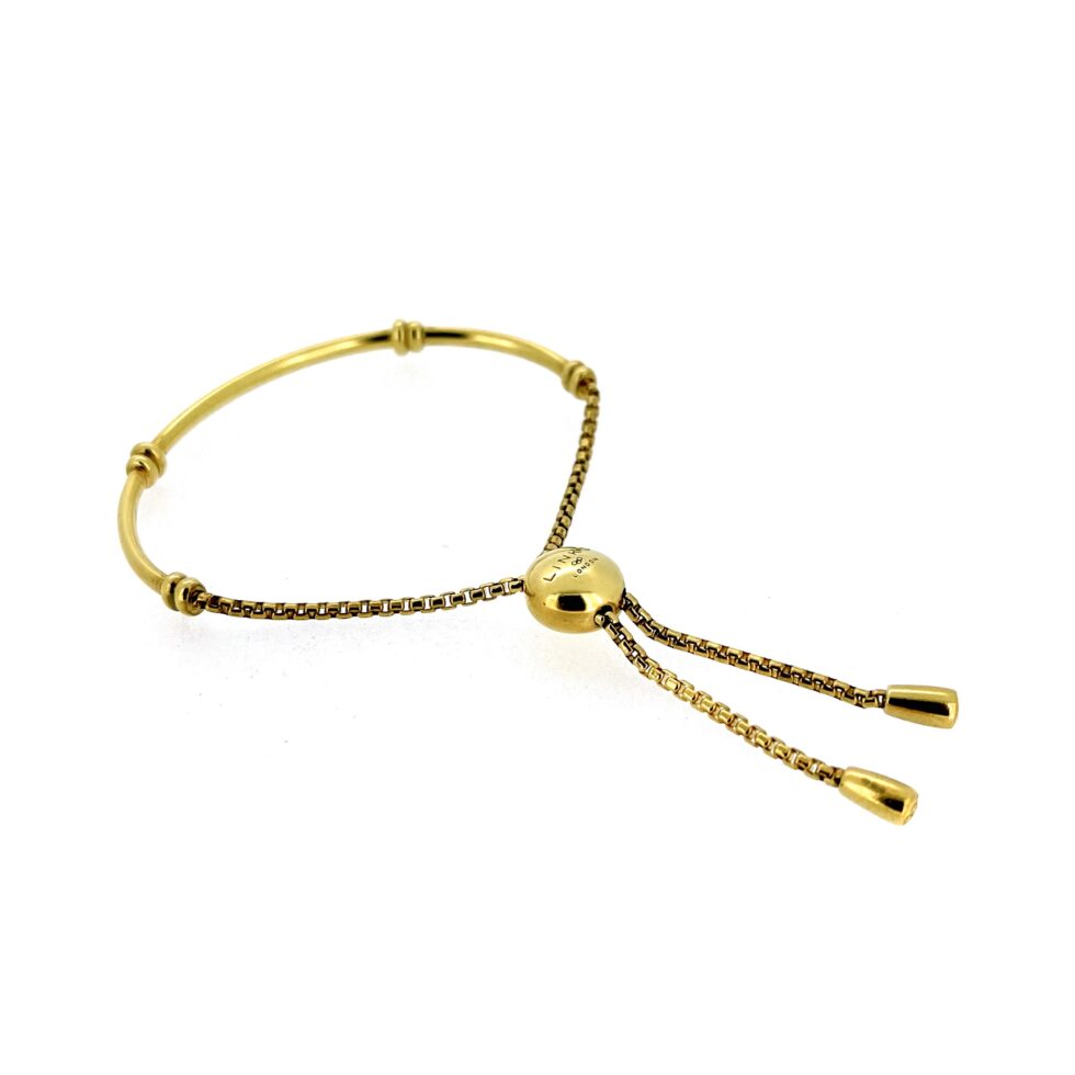 Close-up of gold vermeil half bangle with double bead accents
