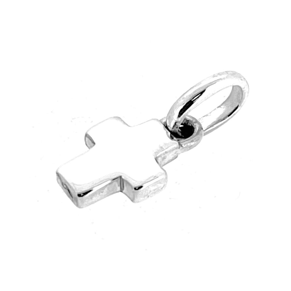 Close-up of polished sterling silver cross charm