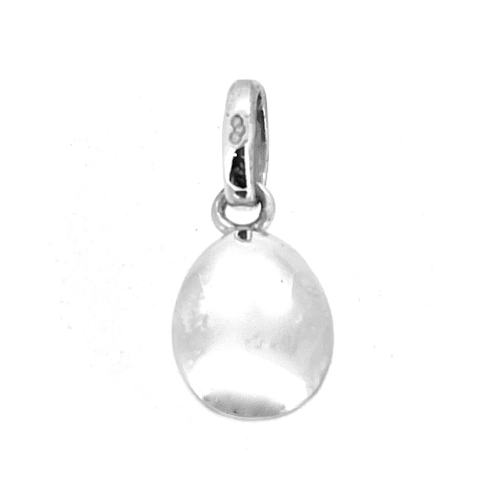 Close-up of polished sterling silver egg charm